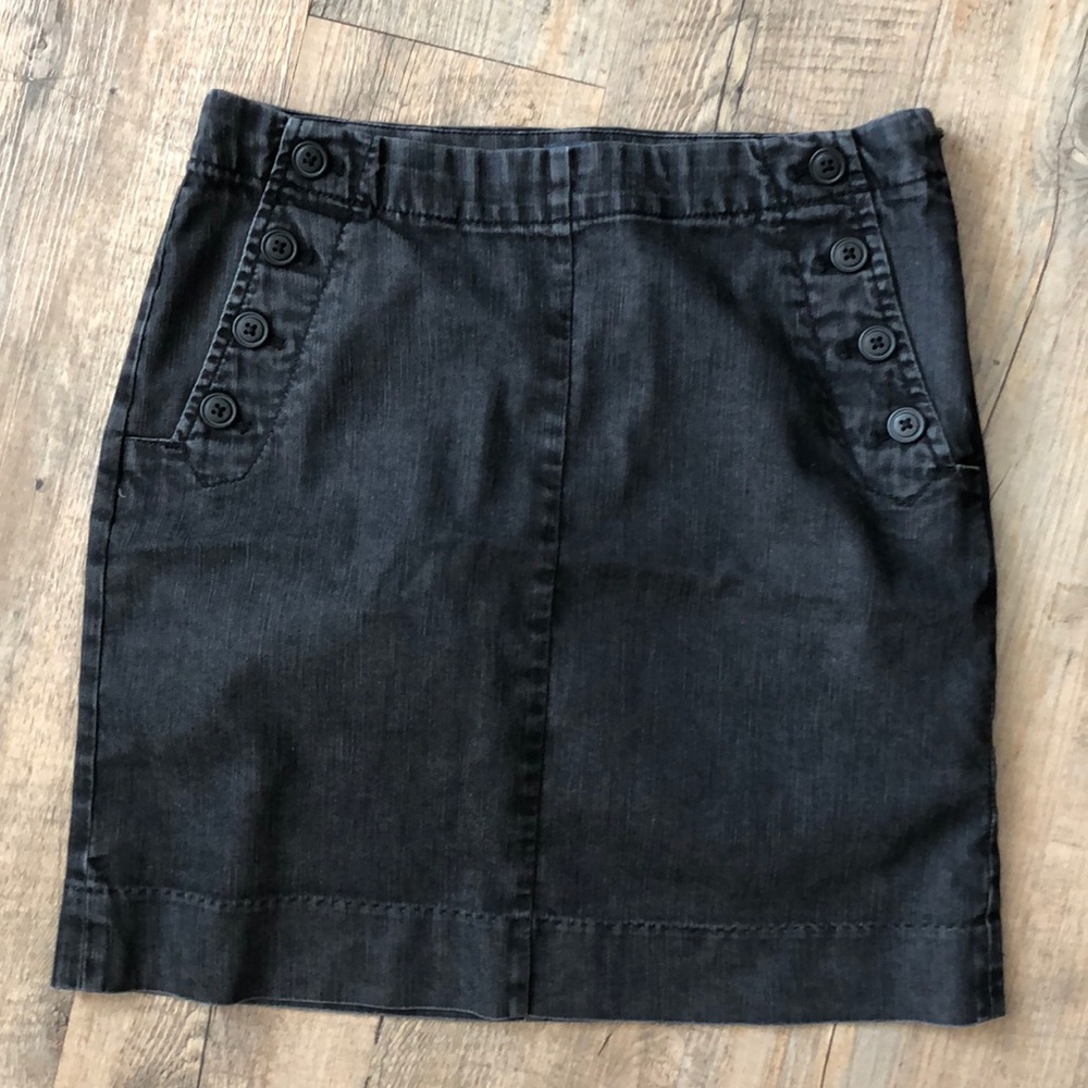 Denim skirt with button detail.